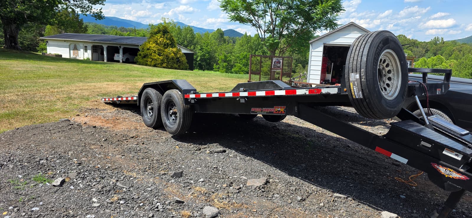 24ft Tilt Trailer for rent - 2023 H&H Speed-Loader FX with hydraulic tilt for ground-level loading of vehicles and heavy equipment.